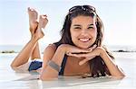 Beautiful woman lying on the beach