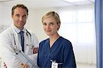 Doctor and nurse smiling in hospital