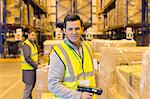 Worker scanning boxes in warehouse