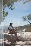 Man using tablet computer outdoors