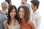 Women smiling together at party