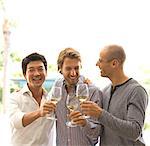 Men toasting each other with wine