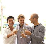 Men toasting each other with wine