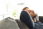 Man relaxing on sofa