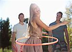 Girl hula hooping outdoors