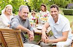 Family smiling together at table