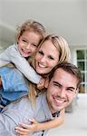 Family smiling together on porch