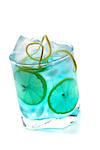 Blue alcohol cocktail with lemon slices isolated on white background