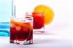 Americano and Negroni cocktails with orange