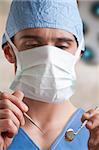 Closeup of a dentist hands about to do a procedure on a patient