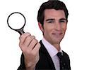 detective holding magnifying glass isolated on whiet