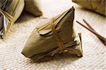 Zongzi or rice dumpling. Traditional steamed sticky  glutinous rice dumplings. Chinese food dim sum. Asian cuisine.