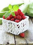 ripe fresh organic raspberries in the basket