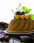 round sponge cake with berries cherry