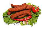 Hot sausages on lettuce, surrounded with vegetables