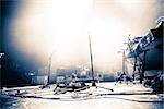 Empty illuminated stage with drumkit, guitar and microphones