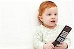 Toddler Baby Watching TV Holding Remote Control