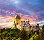 Fairy Palace against sunset sky /  Panorama of Pena National Palace in Sintra, Portugal / Europe