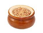 Wholegrain mustard served in a small ceramic pot, isolated on a white background