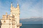 Swallow's Nest Castle tower, Crimea, Ukraine, with blue sky and sea on background