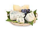 Various types of cheeses and grape. Isolated on a white background.