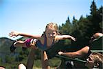 Family enjoying a summer day at Jordan Pond after biking on the carriage trails in Acadia National Park, Maine.