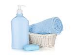 Shampoo bottle, soap and blue towel. Isolated on white background