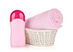 Shampoo bottle and pink towel. Isolated on white background