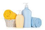 Shampoo bottles and towels. Isolated on white background