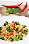 classic Italian penne pasta with broccoli and red chili pepper