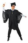 Full body excited Asian male university student in graduation gown jumping isolated on white background