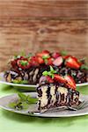 Marble cake with chocolate glaze and strawberries. Shallow dof