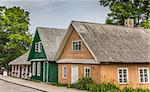 Traditional yellow and green wooden houses in Trakai, Lithuania