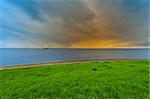 View of the North Sea Coast from Protective Dike, Netherlands, Sunset