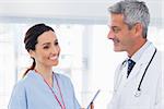 Nurse talking with doctor in medical office