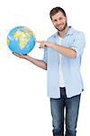 Charming model holding a globe on white background