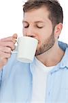 Casual model on white background drinking a coffee