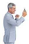 Angry businessman against white background answering phone