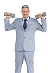 Businessman lifting dumbbells on white background