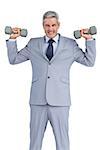 Strong businessman lifting dumbbells on white background