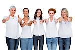 Cheerful casual models posing together with thumbs up on white background