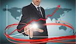 Businessman touching growth graph on futuristic interface with red arrow in world map background