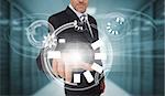 Businessman touching futuristic circle interface in data center