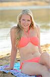 Portrait of Young Woman on Beach by Lake, Bavaria, Germany