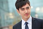 Close-up portrait of confident young businessman, China