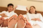 Family in Bed with Bare Feet