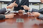 Businesspeople Making Gestures During Business Meeting