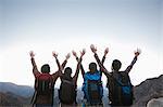 Group of people standing with hands outstretched