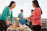 Group of Friends Having a Barbeque on a Rooftop