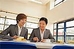 Two person meeting in company cafeteria